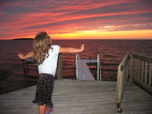 analise-rejoicing-in-front-of-the-sunset
